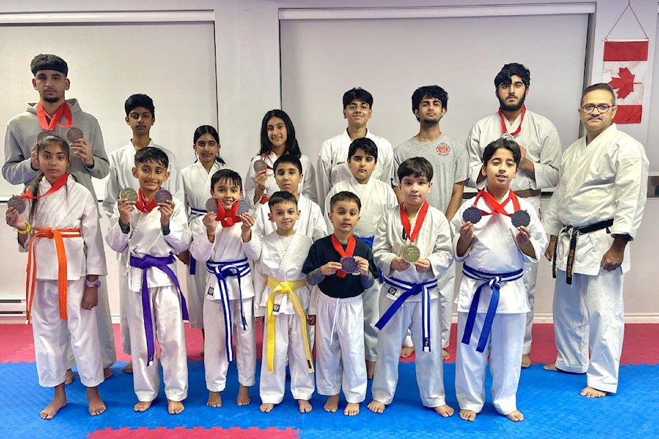 Students and instructors of Yogi’s Karate Dojo in Abbotsford proudly displaying their competition medals.